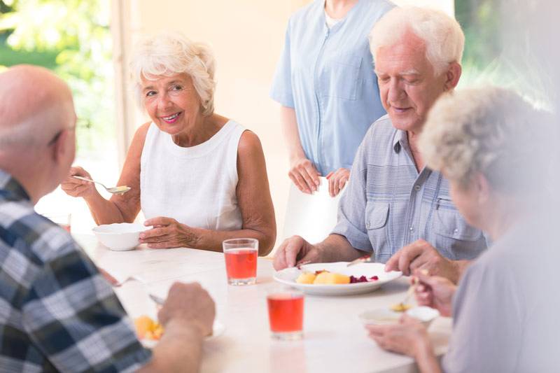 Acorn estates residents eating and talking